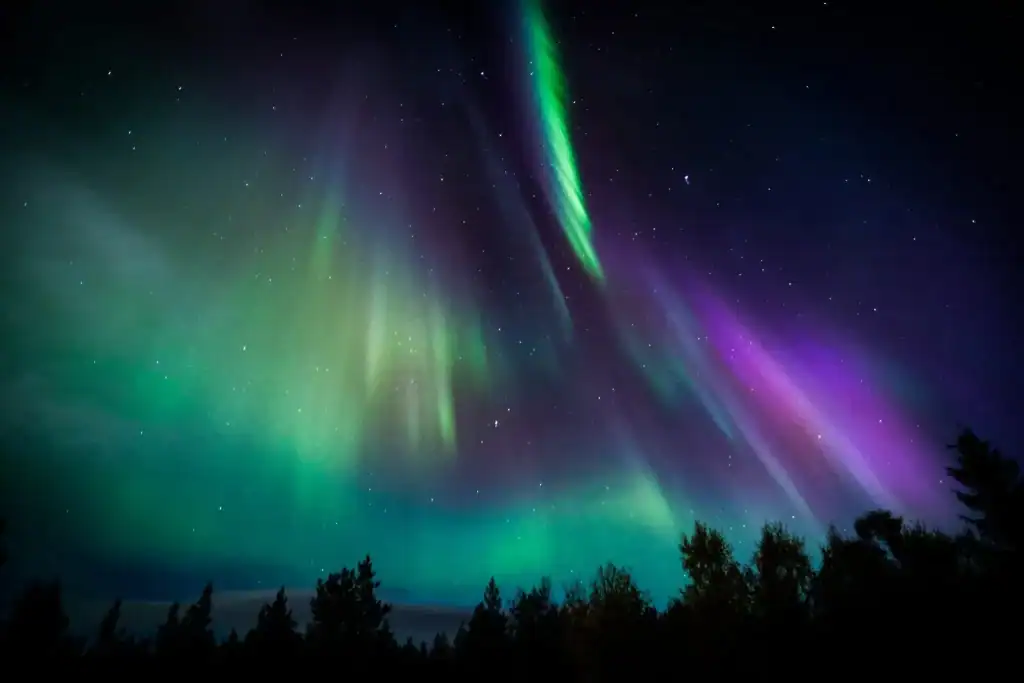 Aurora borealis illuminating the night sky in Finnish Lapland.