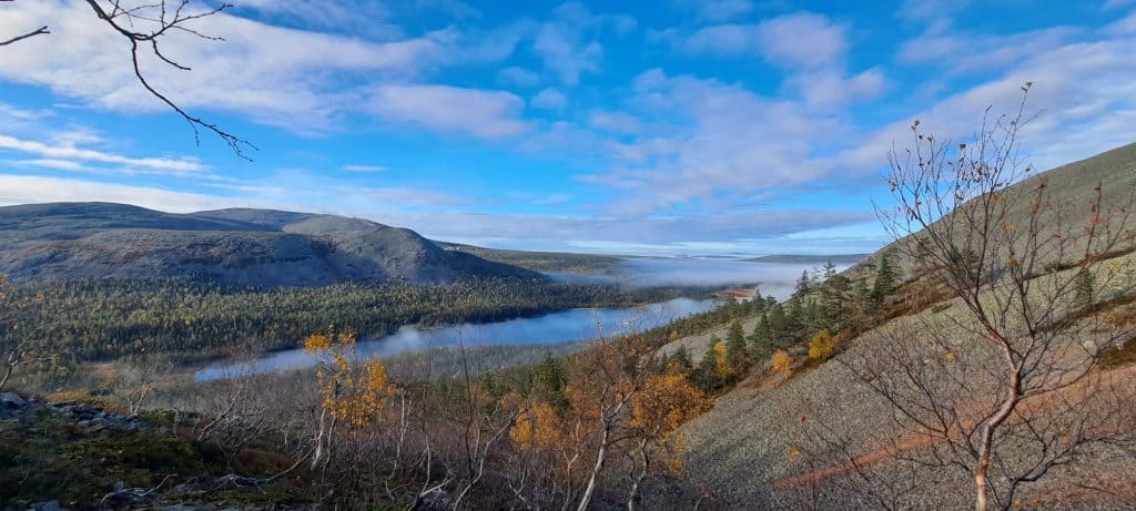 Scenic landscape with lake and mountains.
