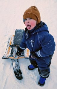 Child playing in the snow